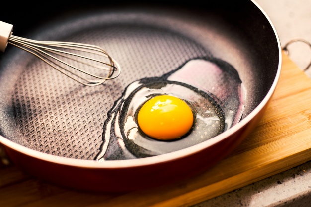 Open egg in a frying pan  Photo |  Download